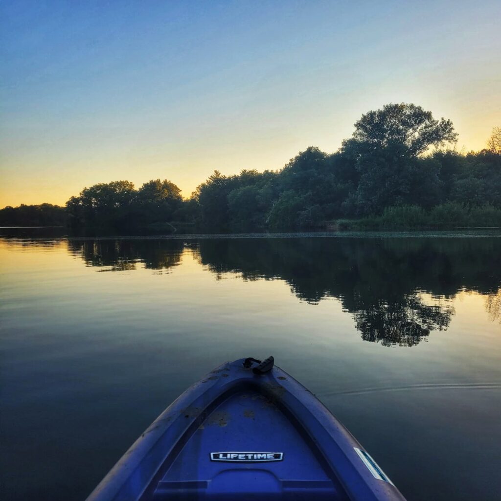 Kayaking at sunset on Evergreen Lake at Comlara Park