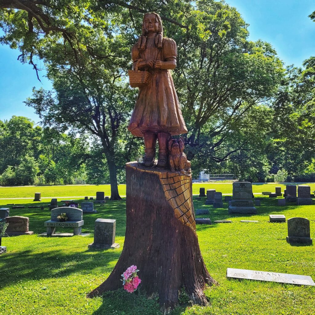 Photo of wood carving of Dorothy of Oz