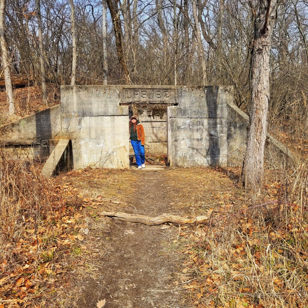 Photo of Jen in front of Lincoln Park Nursery ruins