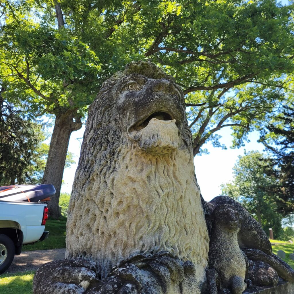 Photo of lion statue at Oakwood Cemetery