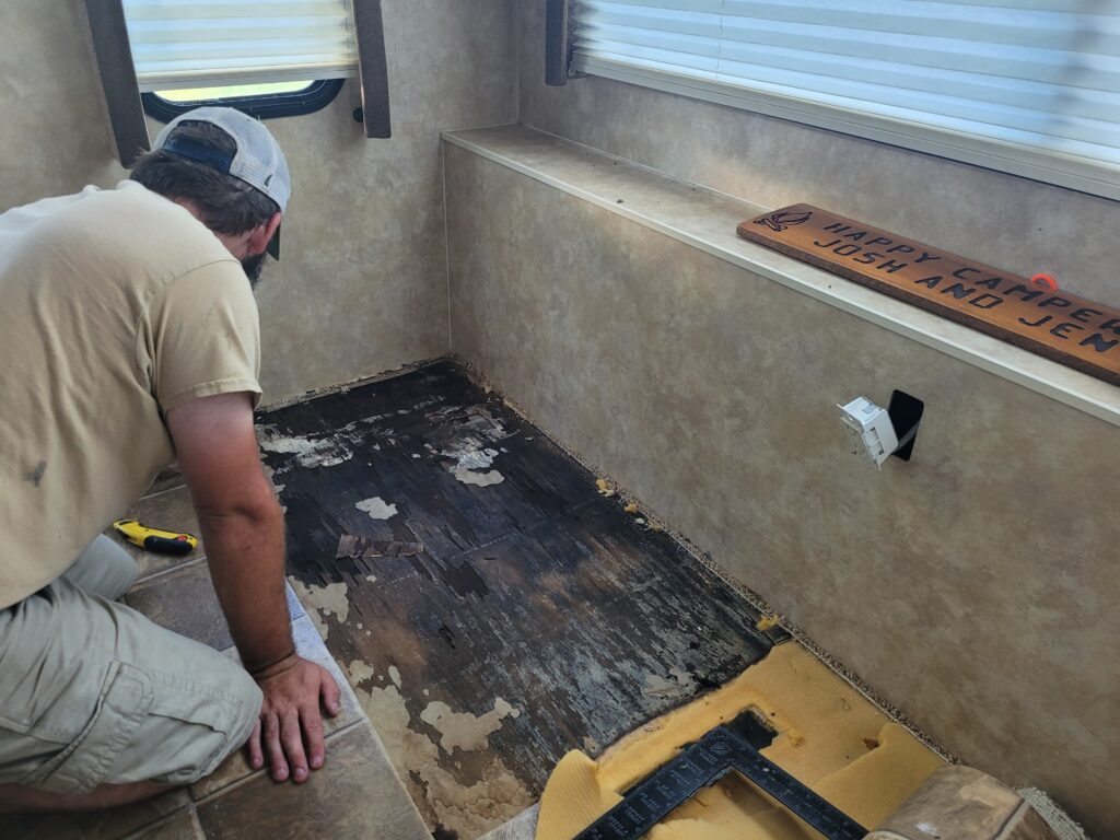 Photo of man doing RV floor repair