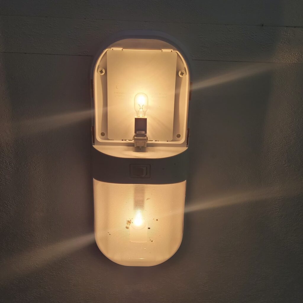 Photo of RV light fixture with incandescent bulb