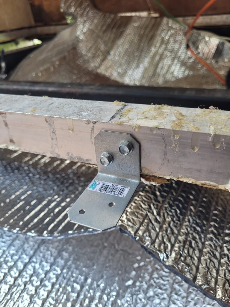 Close up photo of bracket for rv subfloor