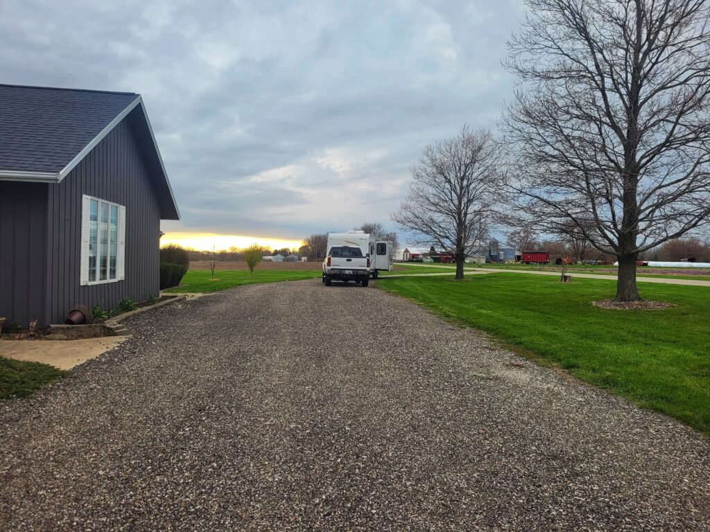 Photo of our camper parked in farm driveway