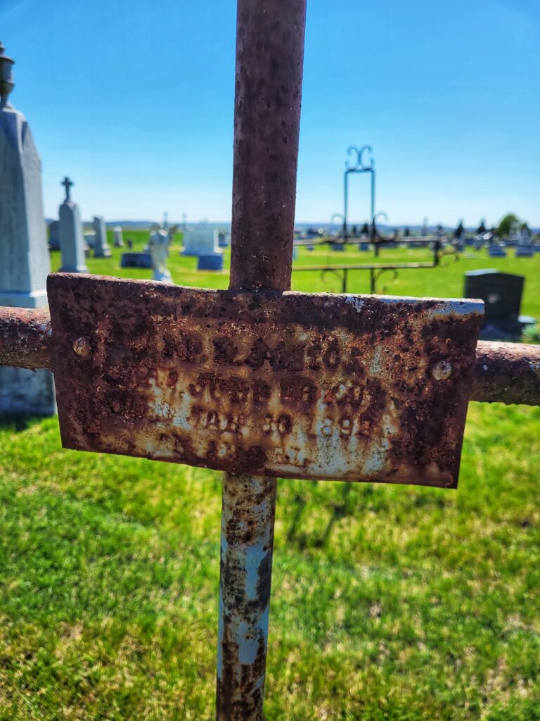 Iron cross at Saint Joseph Cemetery in Prarirue du Rocher