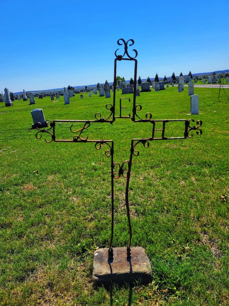 Iron cross grave at Saint Joseph Cemetery in Prarirue du Rocher