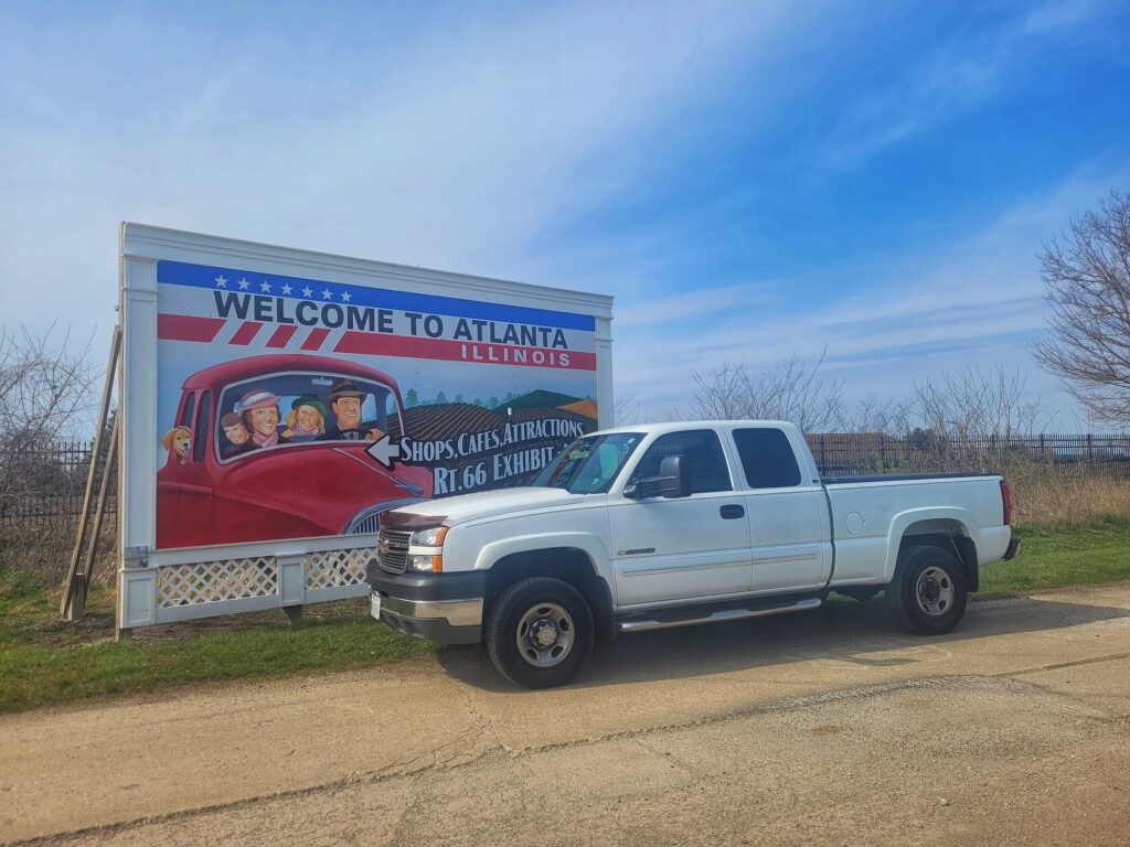 Truck in front of route 66 billboard