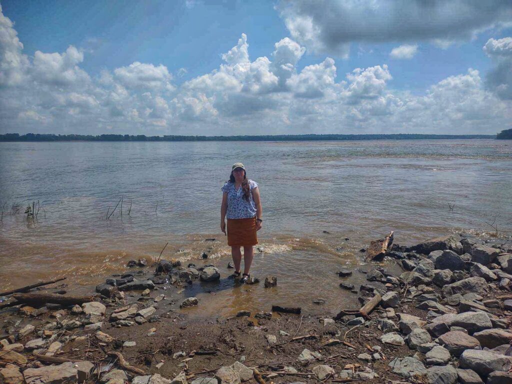 photo of Jen standing in mississippi and ohio river confluence