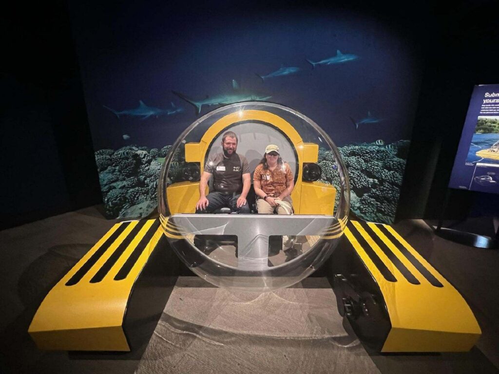 photo of josh and jen in submersible photo op