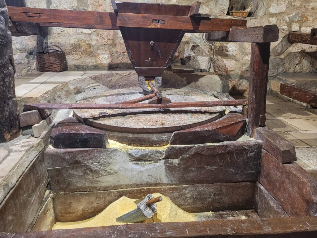 photo of mill stone grinding corn