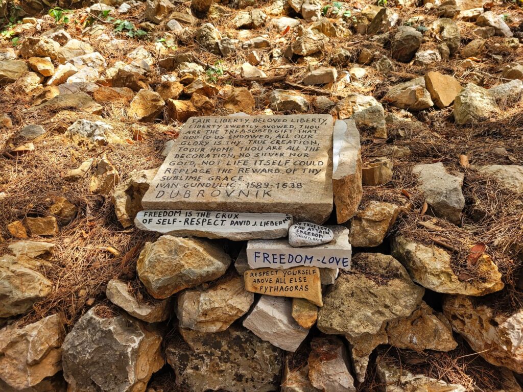 photo of rocks with different quotes written on them