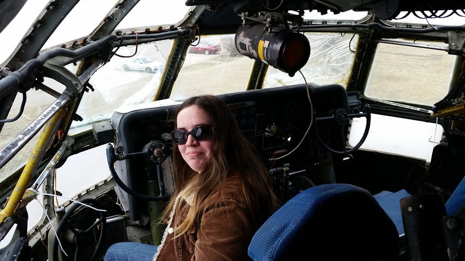 photo of jen in a plane cockpit