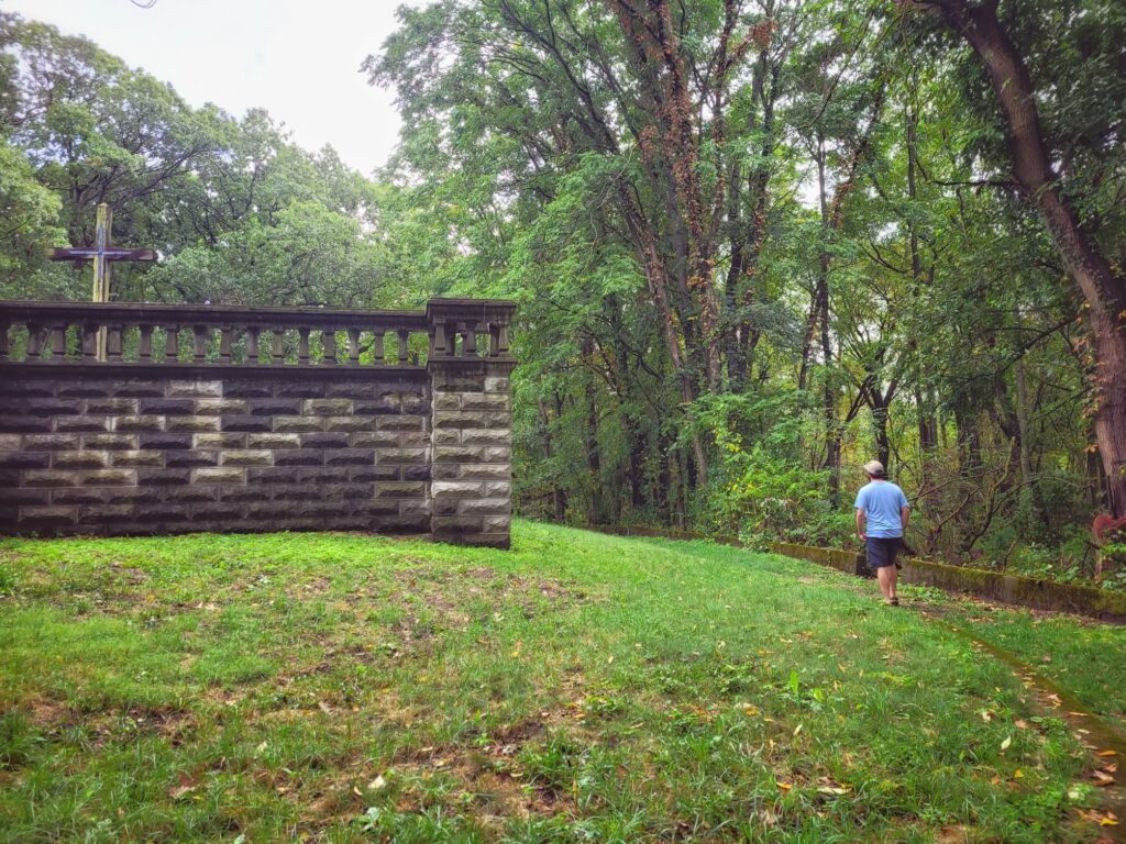 photo of josh walking next to bailly cemetery