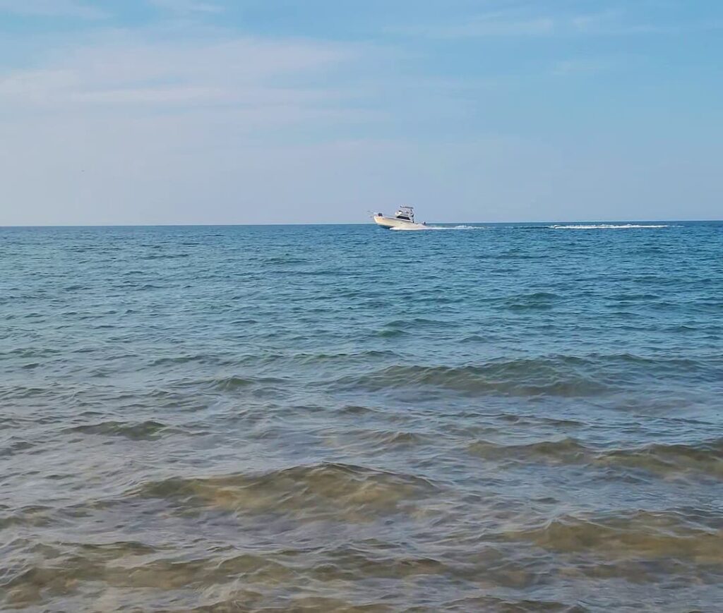 photo of boat on lake michigan