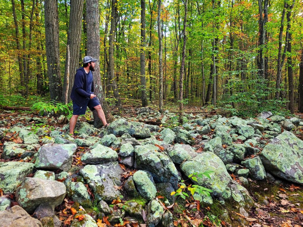 photo of josh playing disc golf on top of rocks