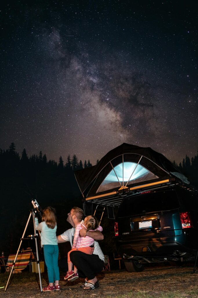 photo of family using a telescope