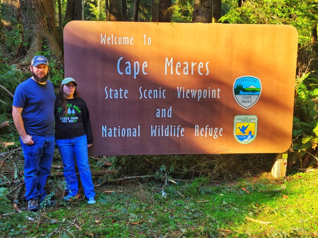 photo of josh and jen with cape meares sign