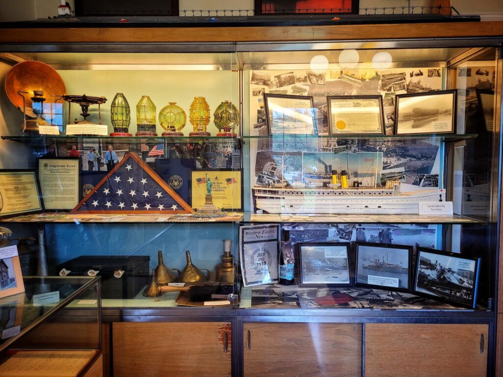 photo of old lighthouse museum display case about the ss eastland disasaster