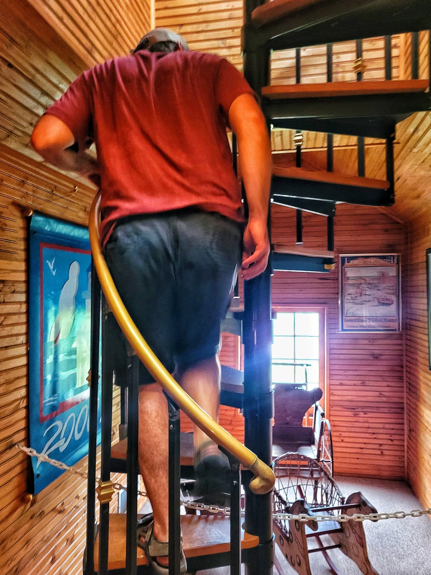 photo of josh walking up stairs in old lighthouse museum