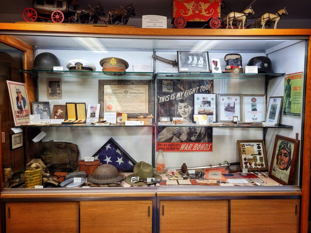 photo of old lighthouse museum display case with local military history