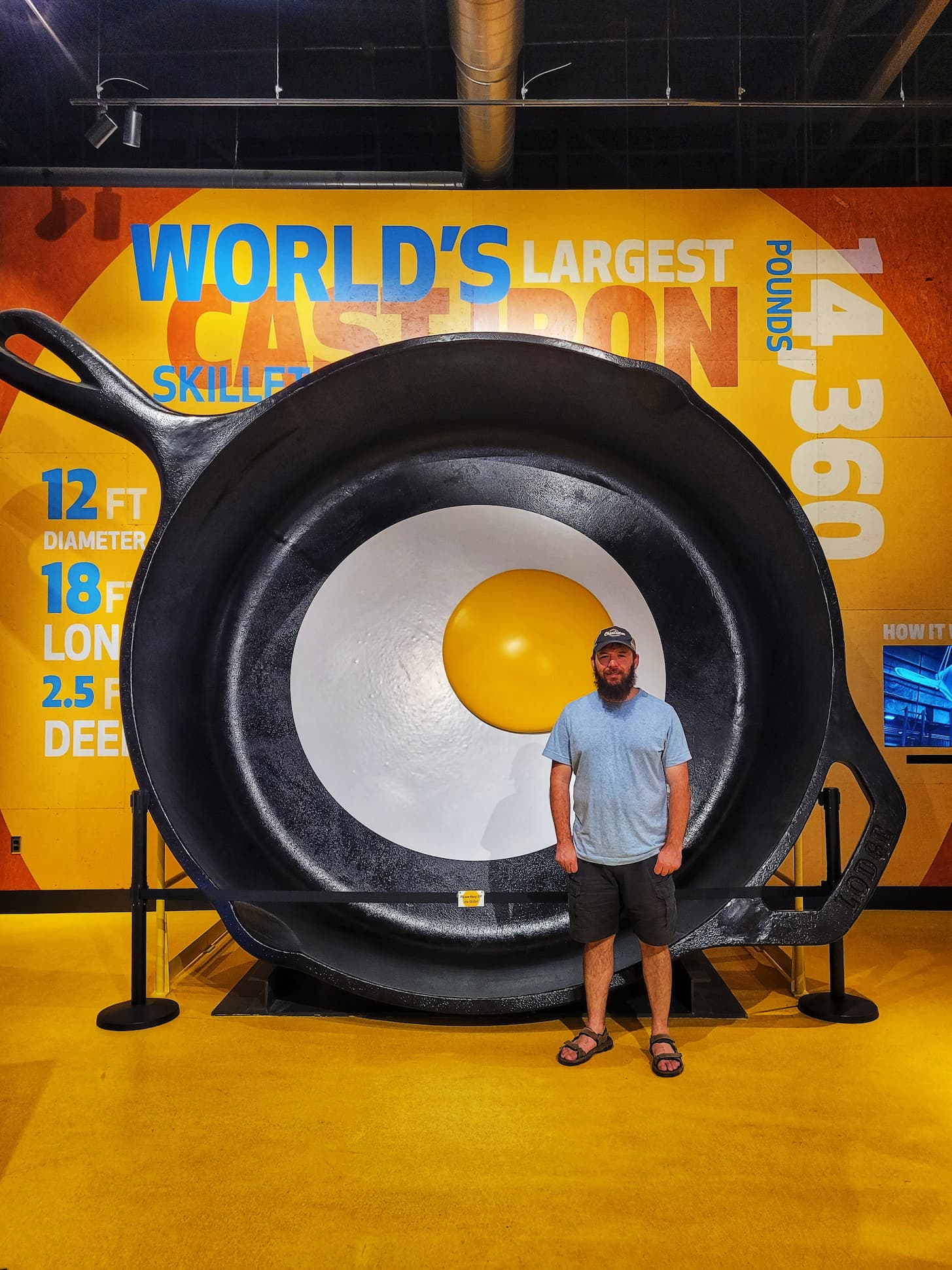photo of josh with world's largest cast iron skillet