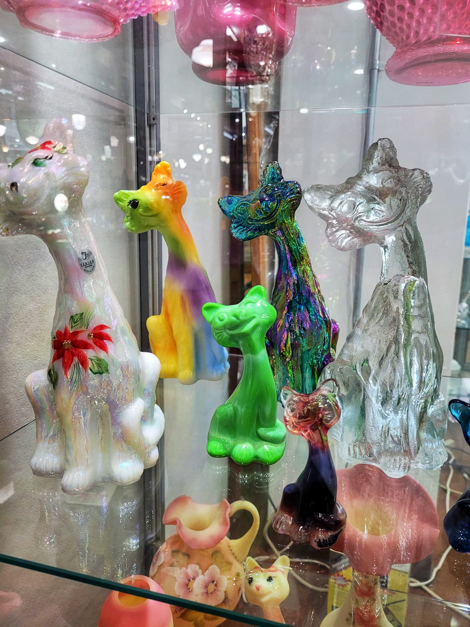 photo of display of glass cats at american museum of glass