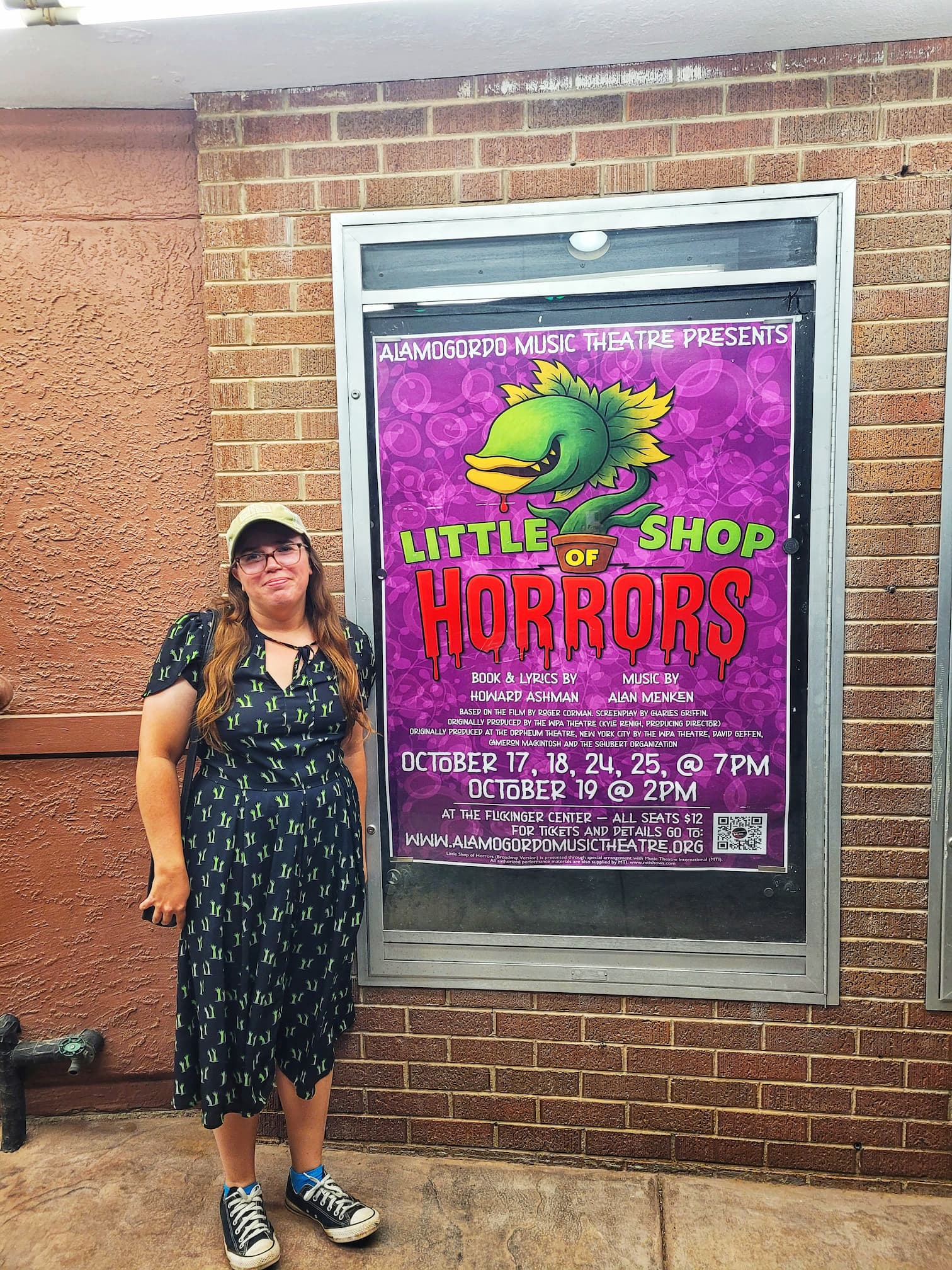 photo of jen with little shop of horrors banner