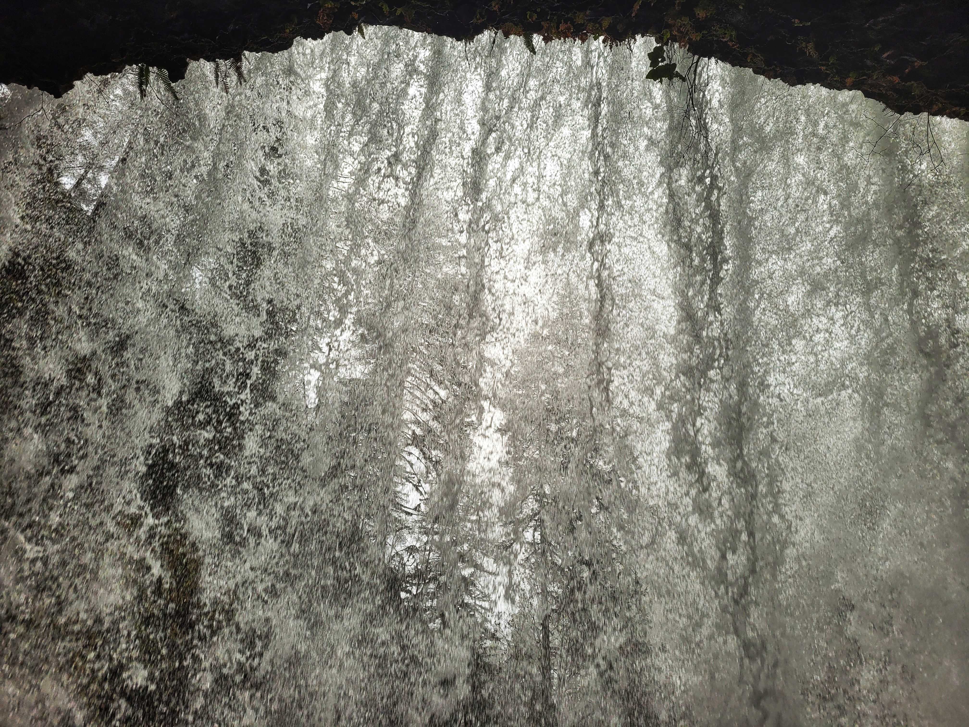 photo of behind waterfall
