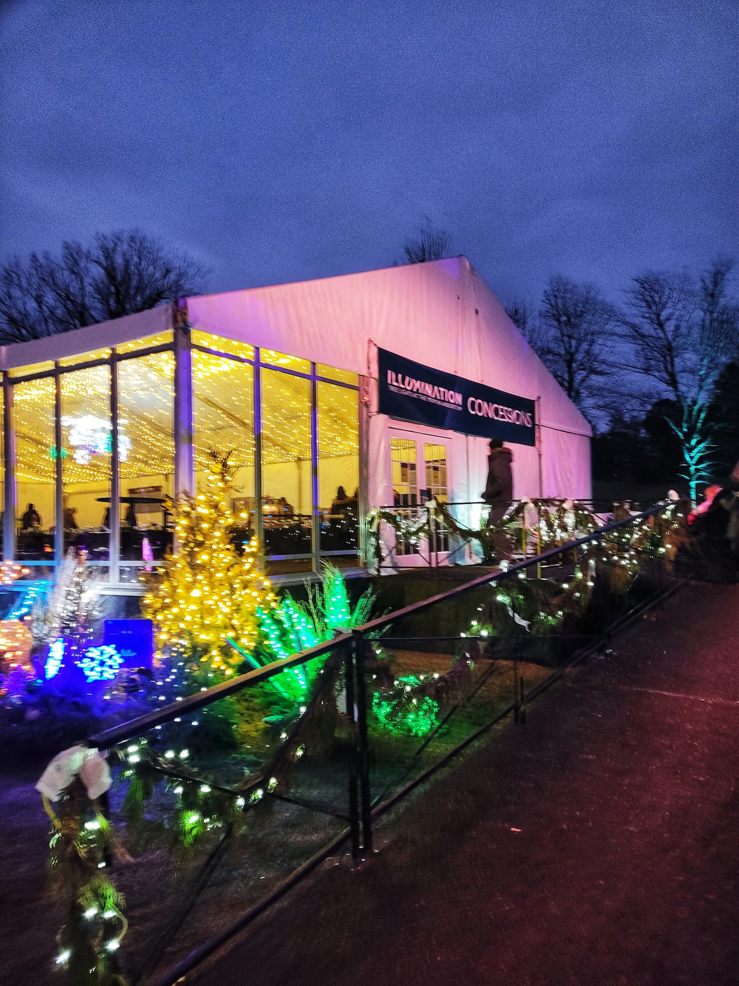 photo of morton arboretum illumination: tree lights walk through christmas light display concession tent