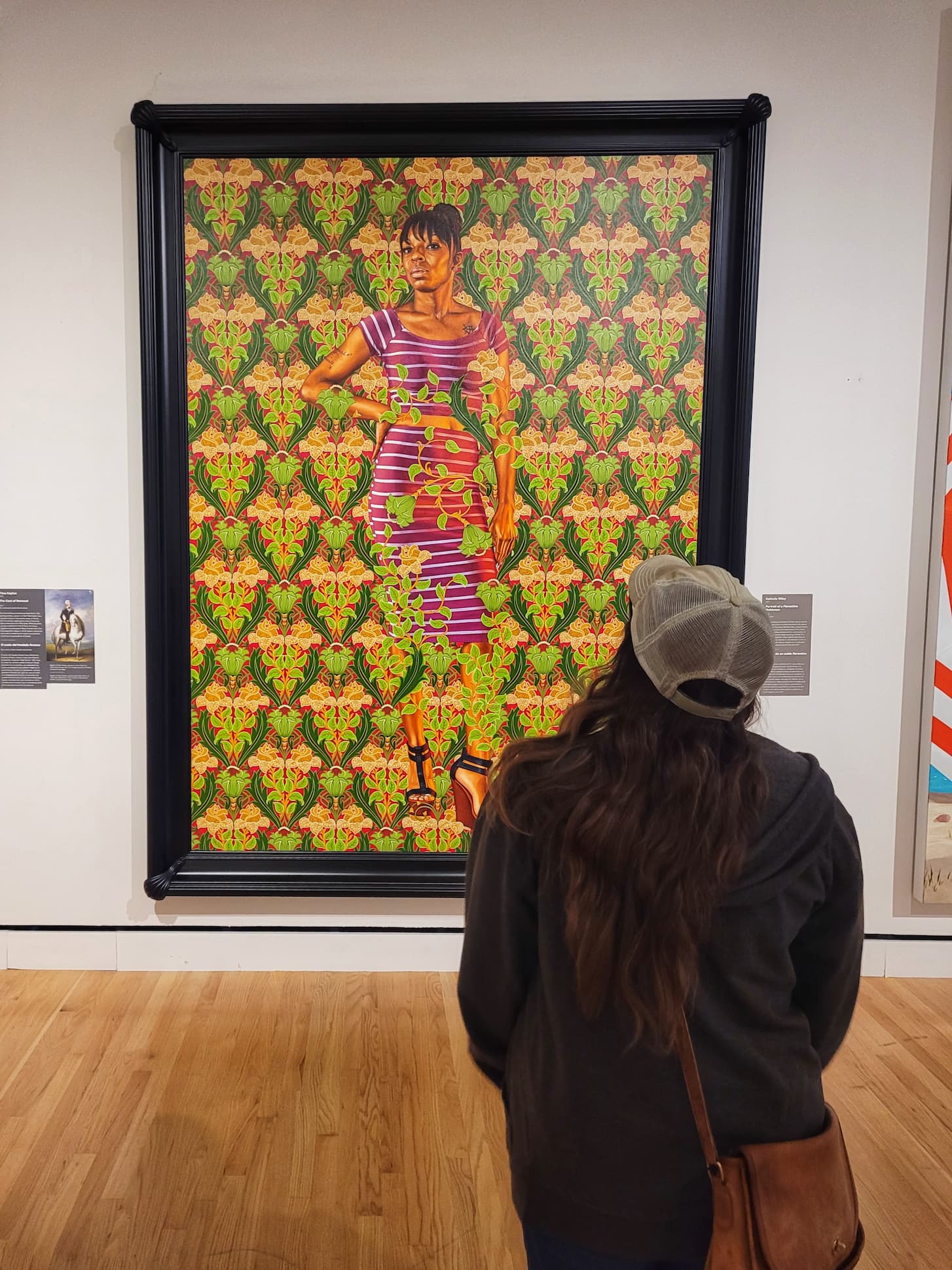 photo of  jen with portrait of a florentine nobleman painting by kehinde wiley 