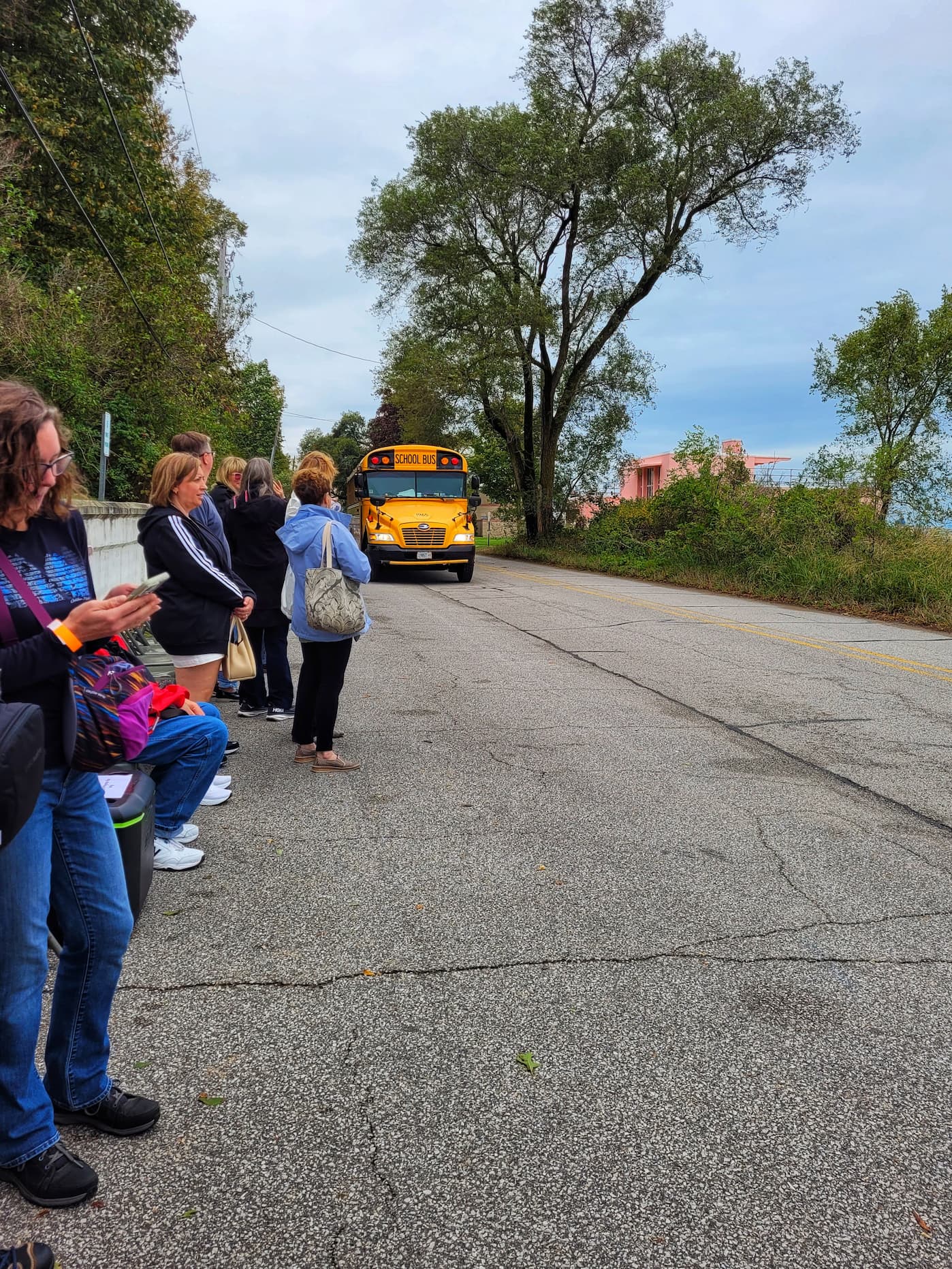 photo of group waiting for shuttle for century of progress homes tour