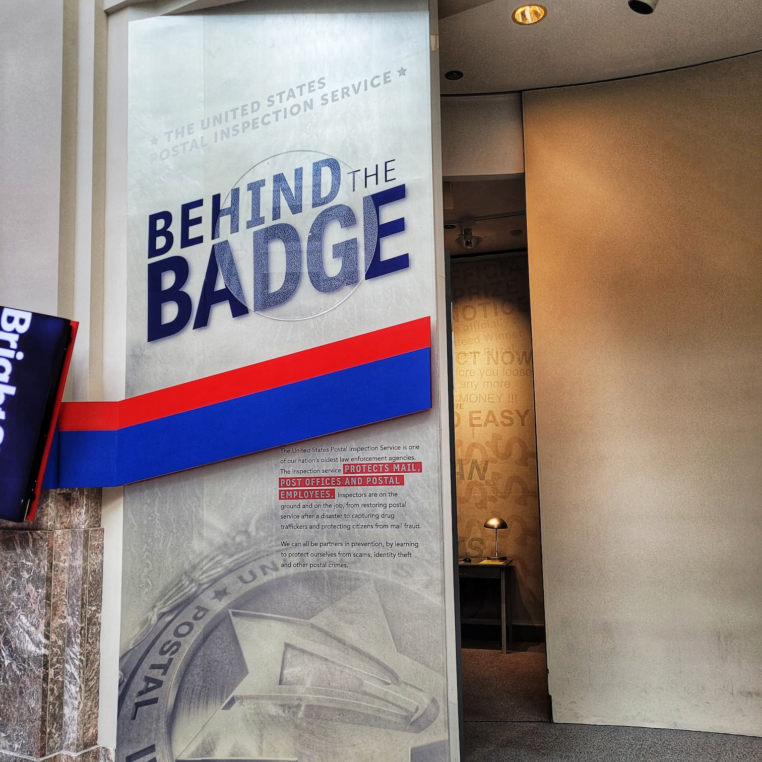 photo of national postal museum behind the badge exhibit sign
