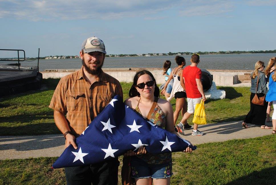 photo of josh and jen at fort sumter with american flag