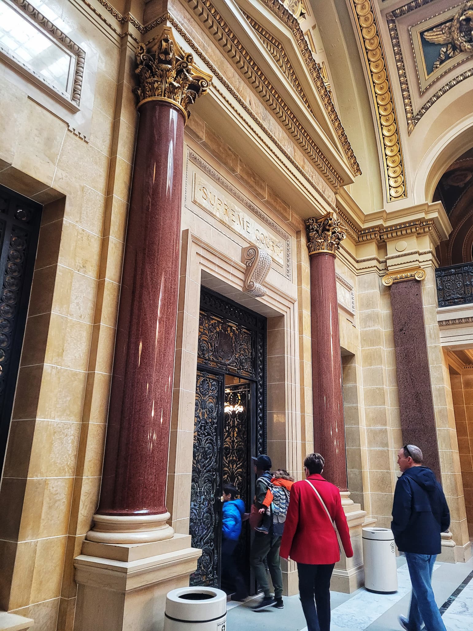 photo of our tour group walking into the  wisconsin capitol supreme court chambers