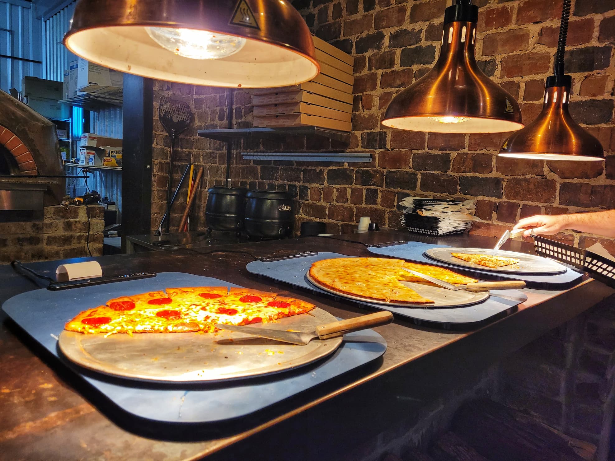 photo of pizza buffet at bricks and brews