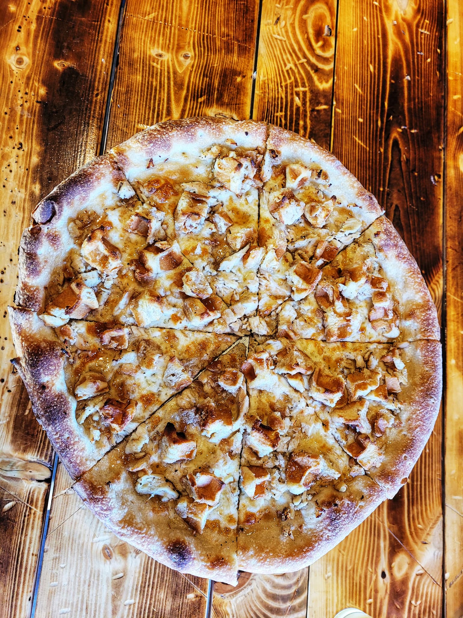 photo of chicken and waffle pizza at guthrie brewing