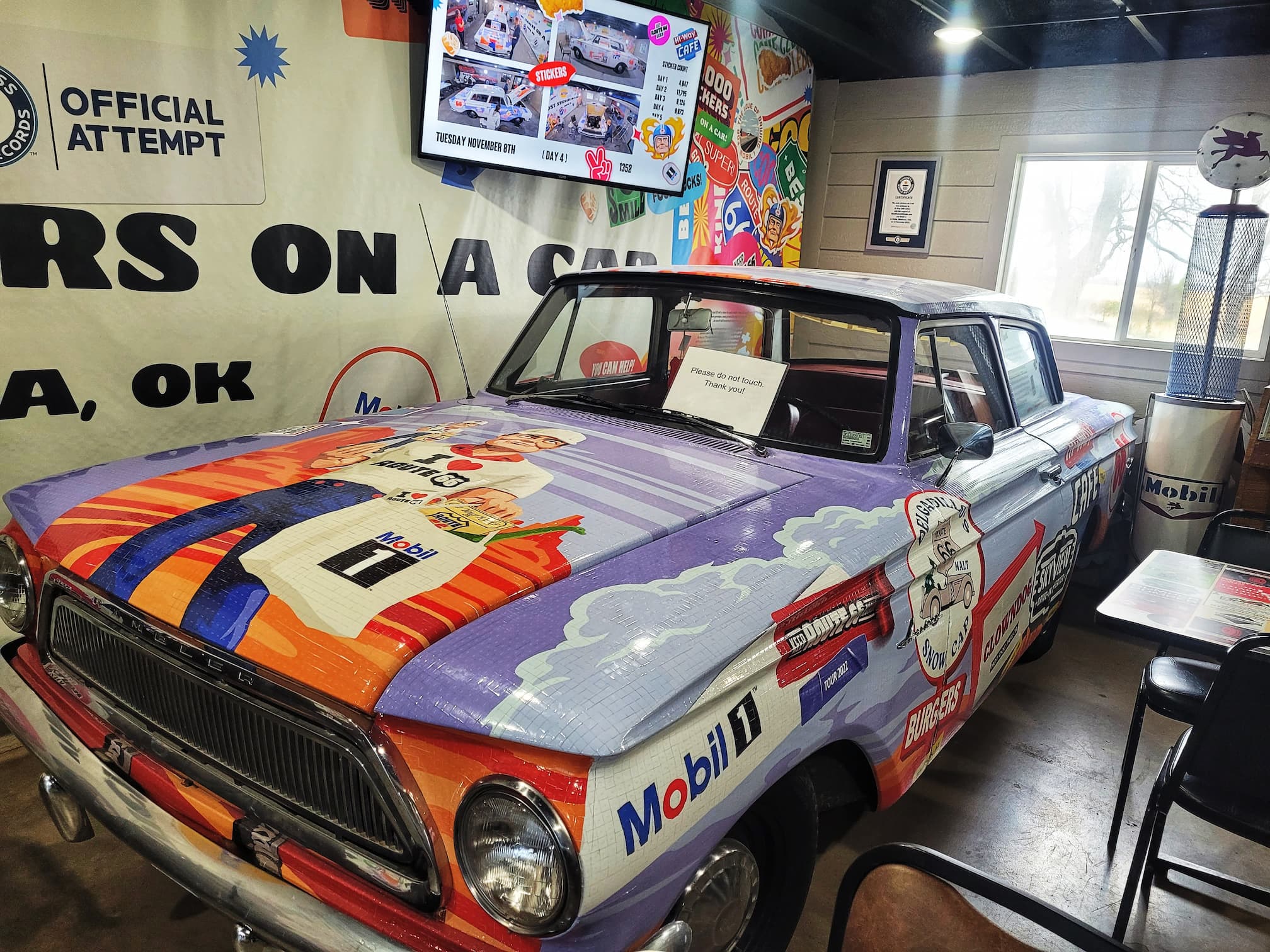 photo of guinness world record car with the most stickers on it