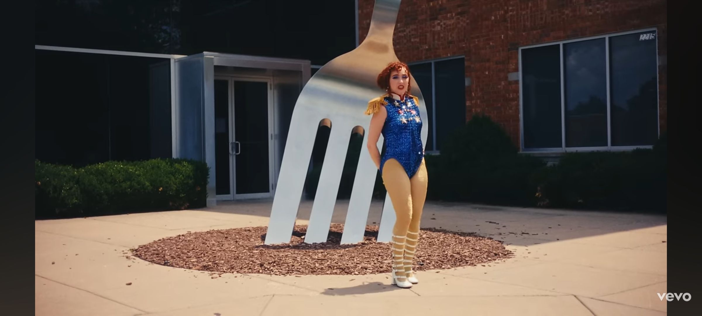 screenshot of hot to go music video with world's largest fork by mass