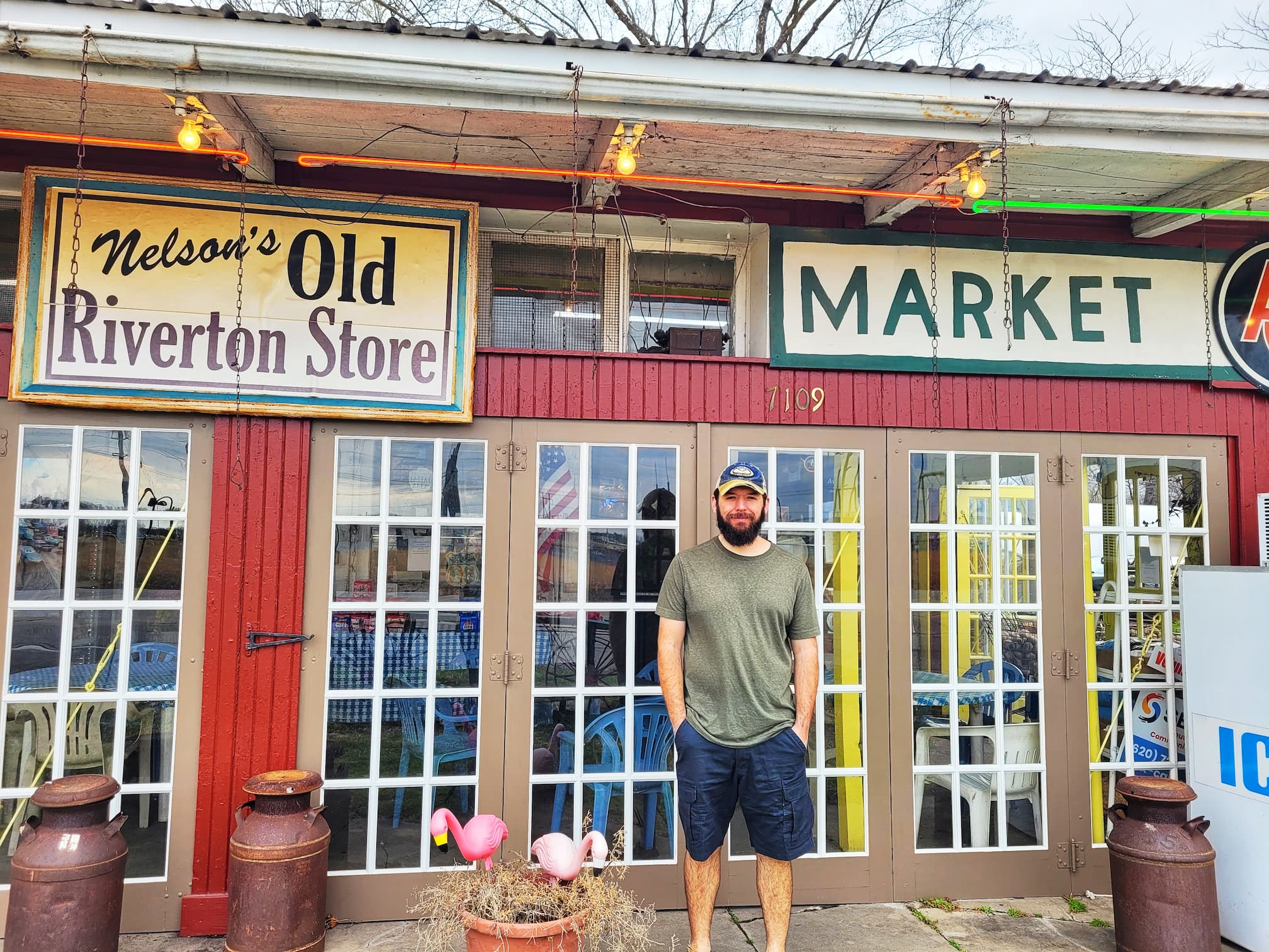 photo of josh in front of nelson's old riverton store