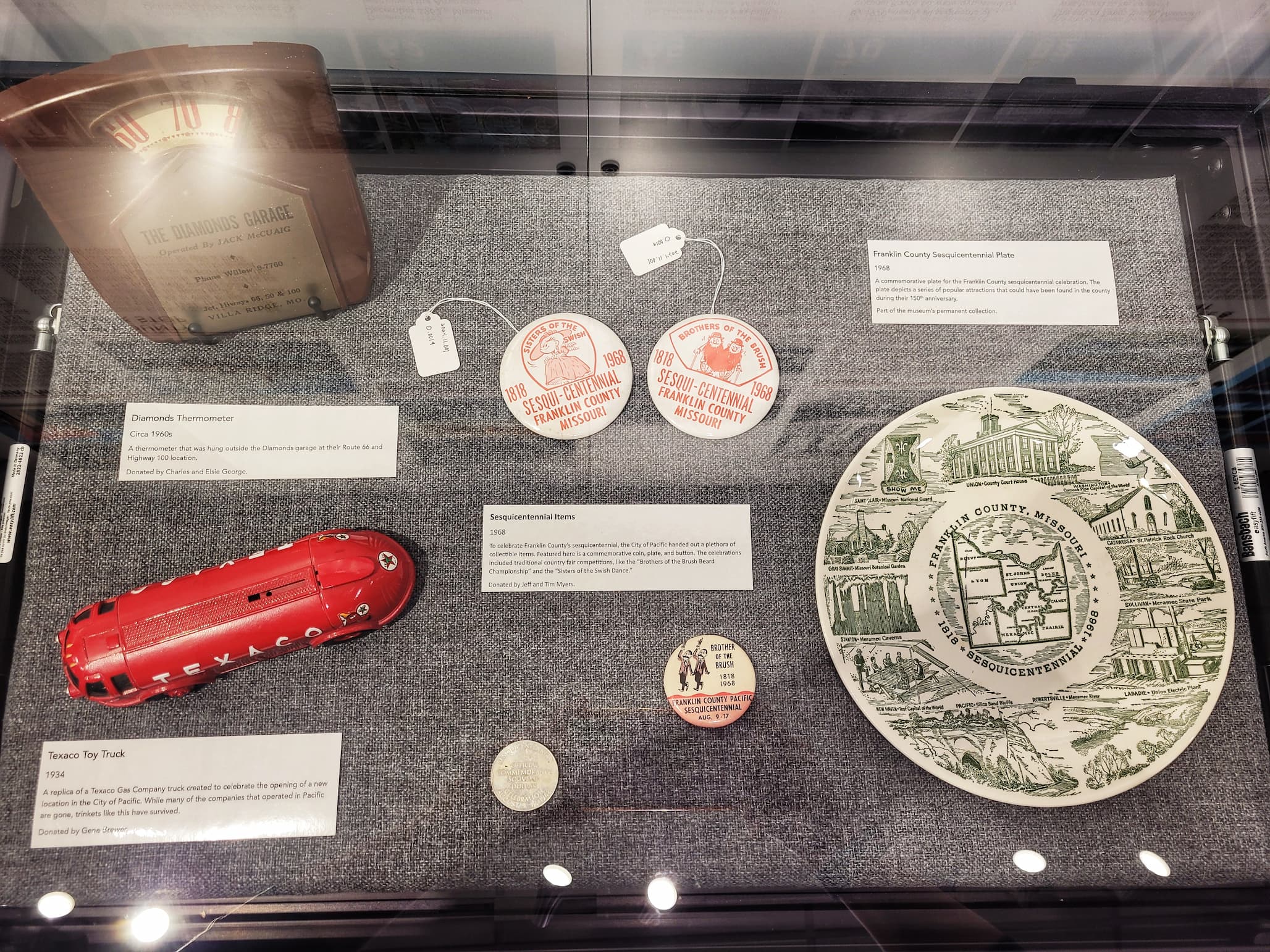 photo of display case of local artifacts at red cedar inn museum