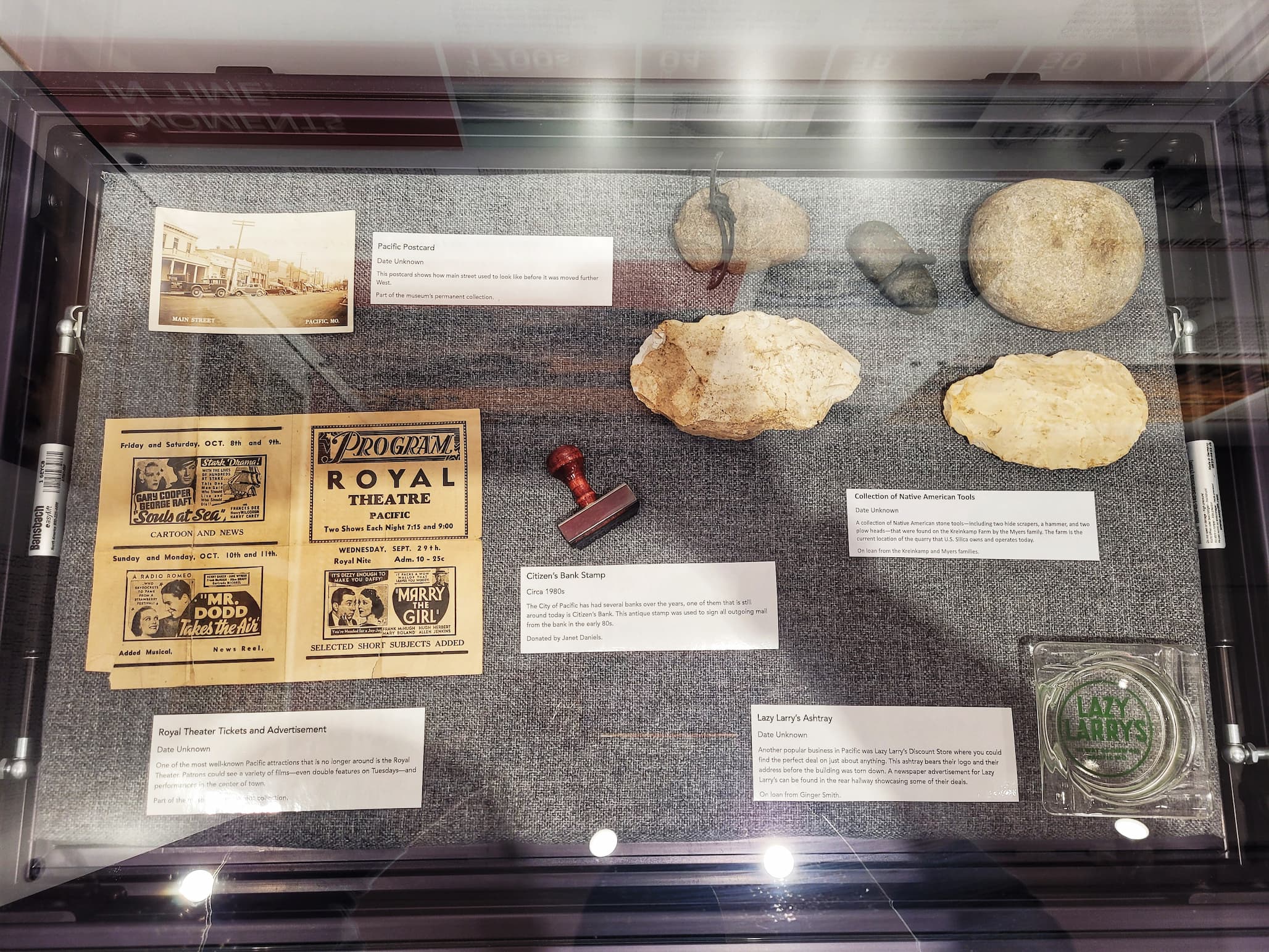 photo of display case of local artifacts at red cedar inn museum
