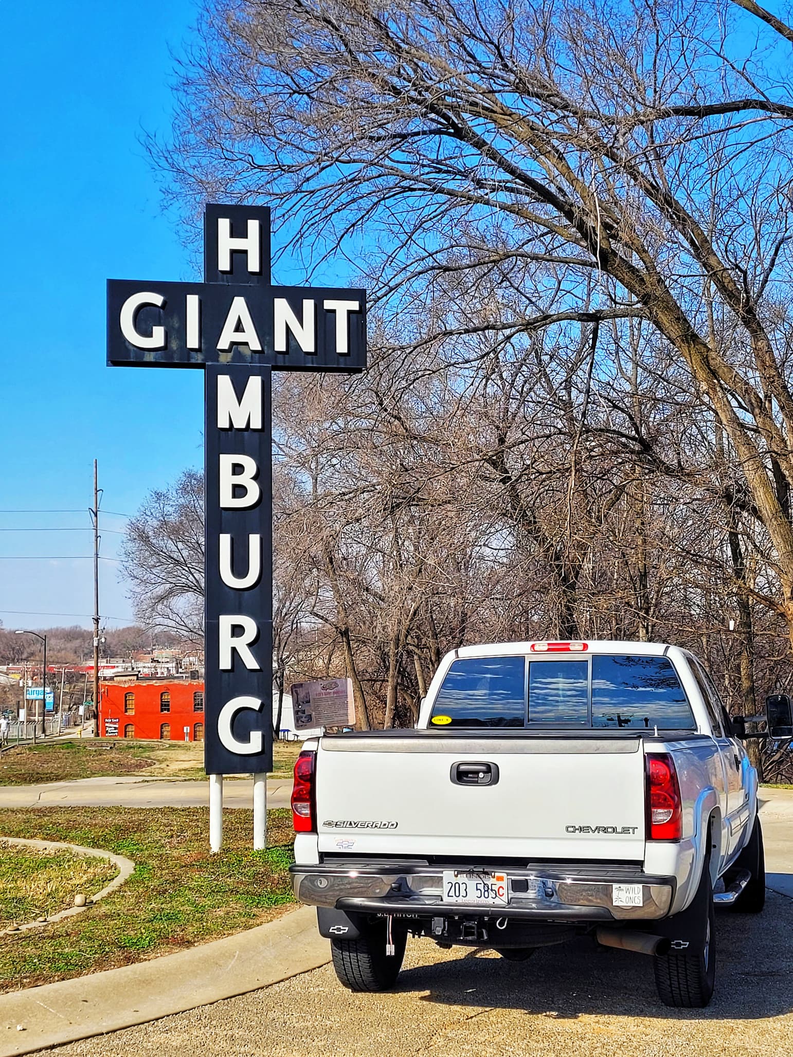 photo of our white pickup truck in front of giant hamburg sign