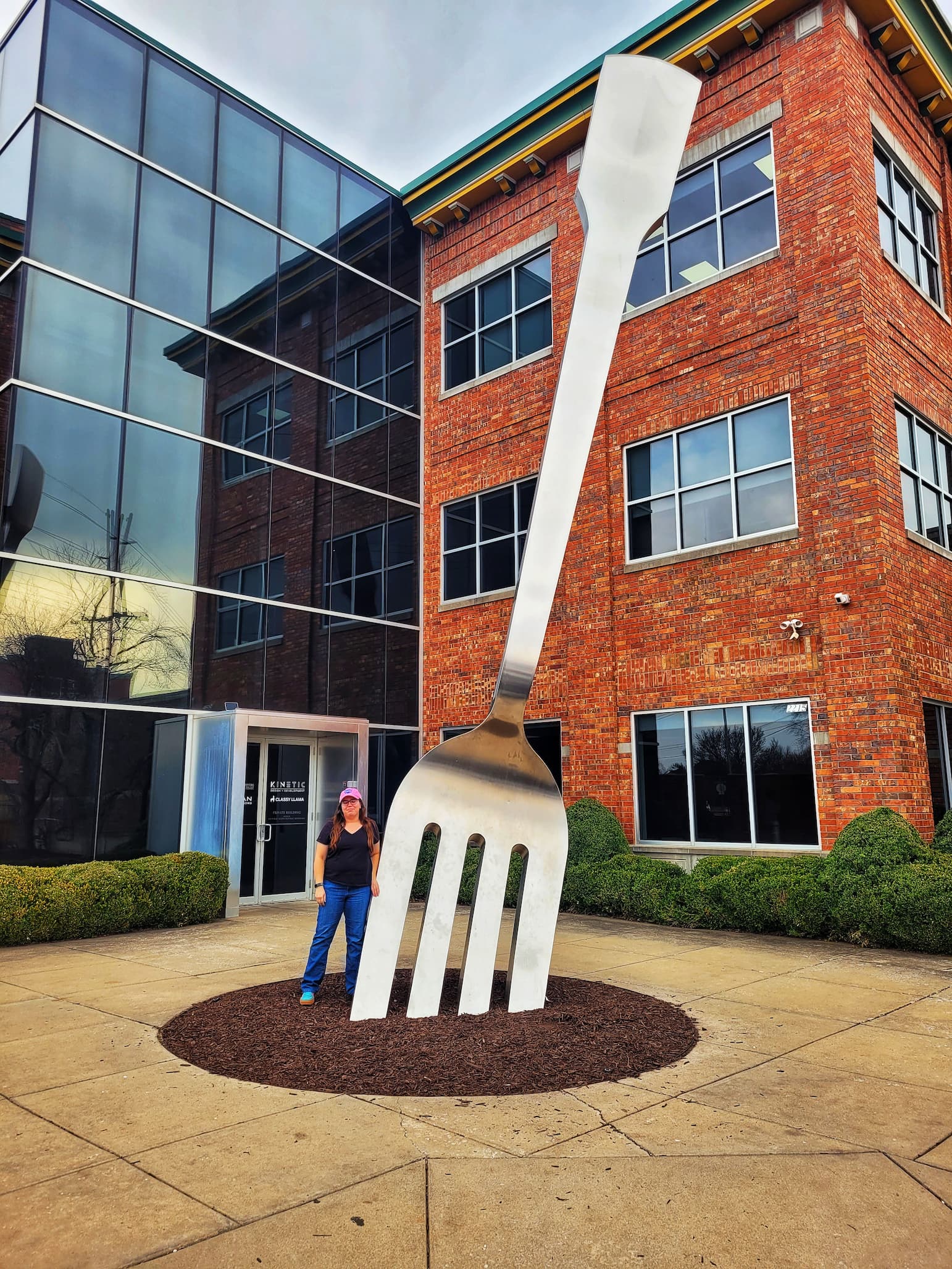 photo of jen in front of world's largest fork by mass