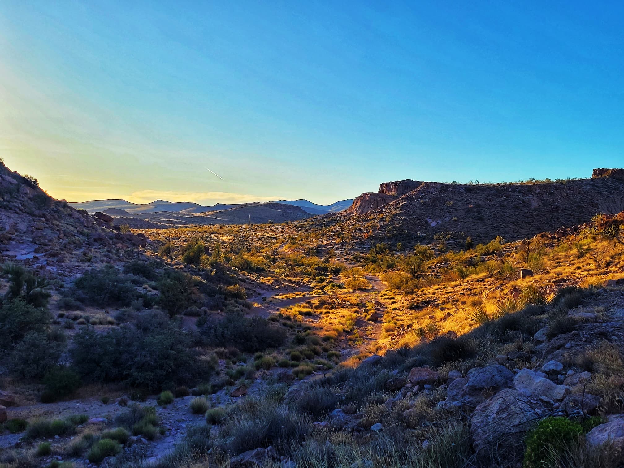 photo of sun setting over white cliffs wagon trail